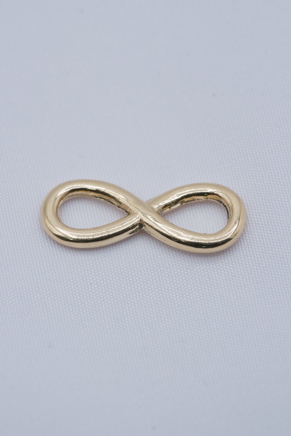 Herraje infinito oro amarillo 18k 0,77 gr / 2 cm