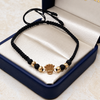 Pulsera tejida Herraje Rx silueta, balines #4 y neoprenos negros Oro amarillo 18k 0,62 Gr