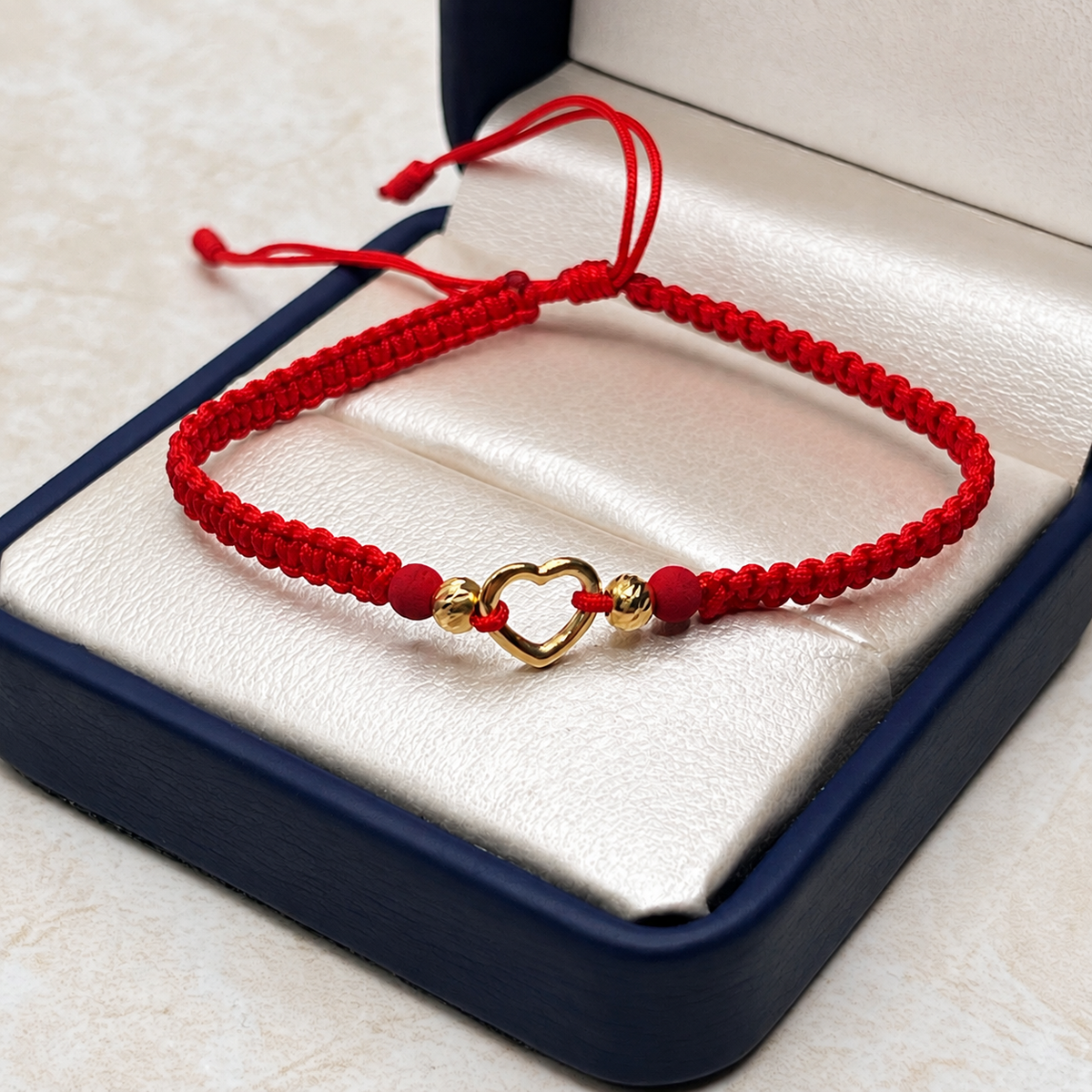 Pulsera tejida Balines #4 y Herraje corazon silueta Oro amarillo 18k 0,40 Gr