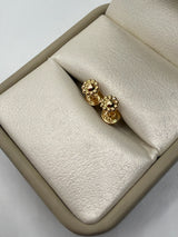Topos florecita oro amarillo 18k 0,48 gr / 5 mm