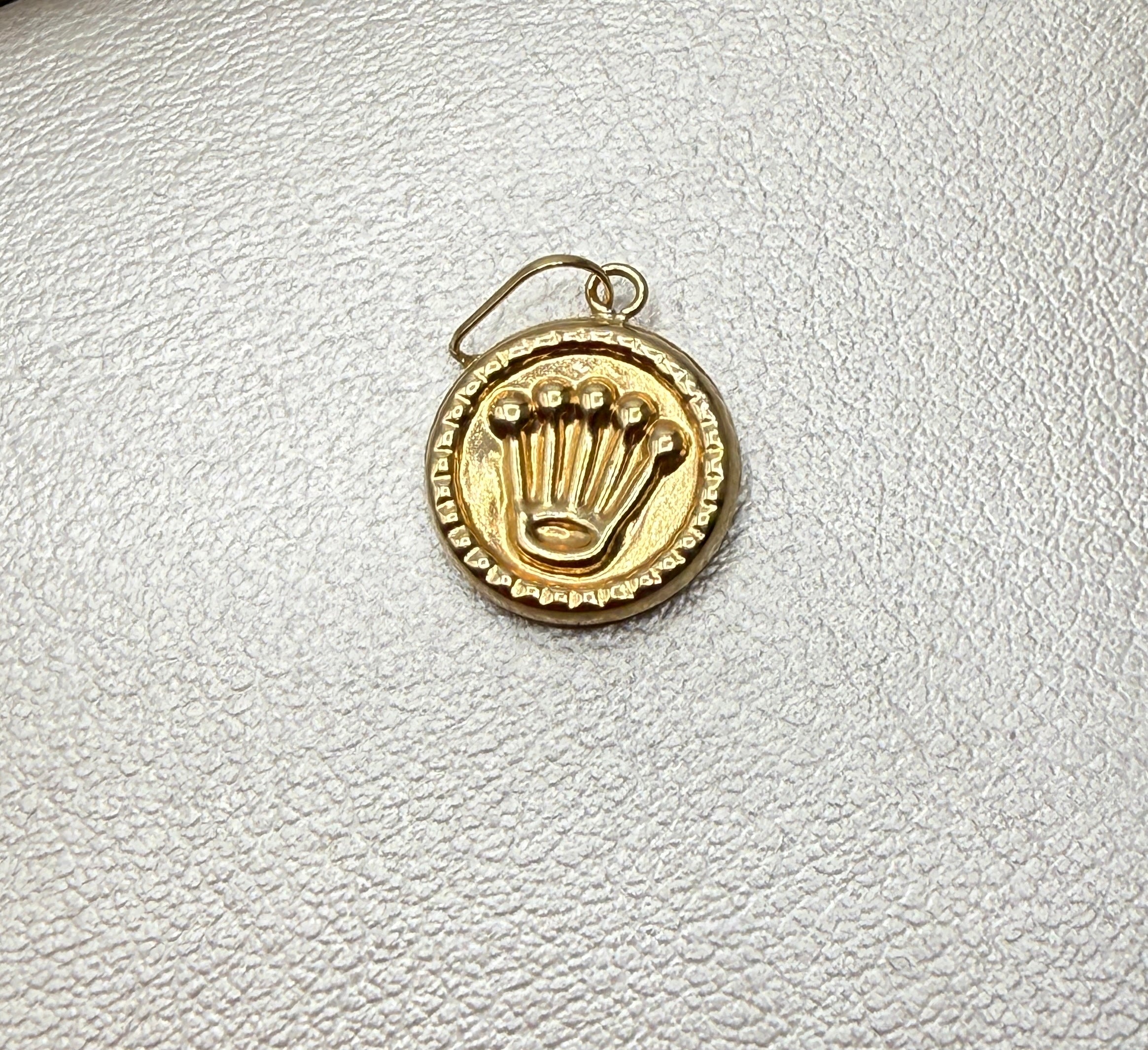 Dije RX oro amarillo 18k 0,52 gr / 2 cm