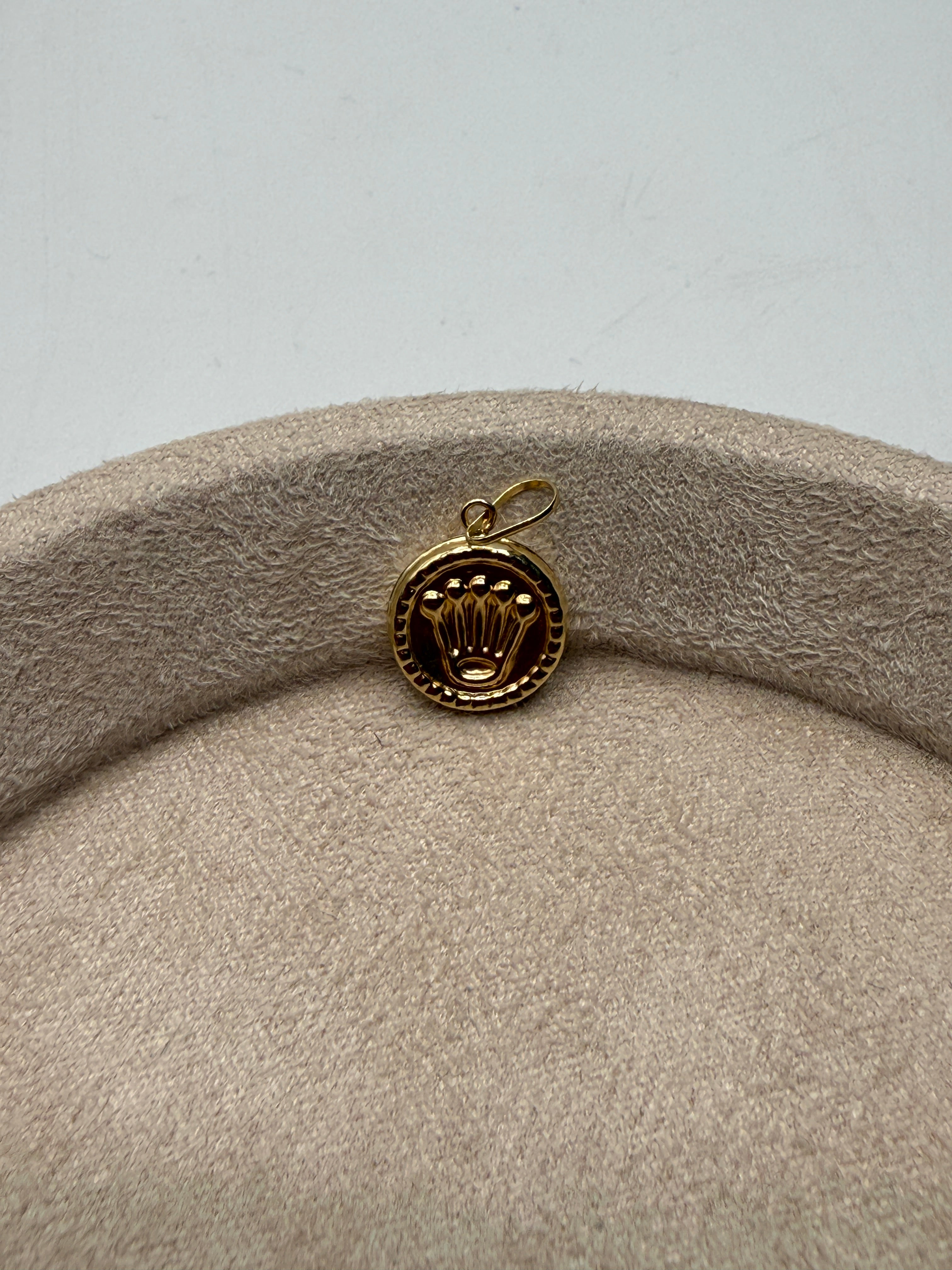 Dije RX oro amarillo 18k 0,52 gr / 2 cm